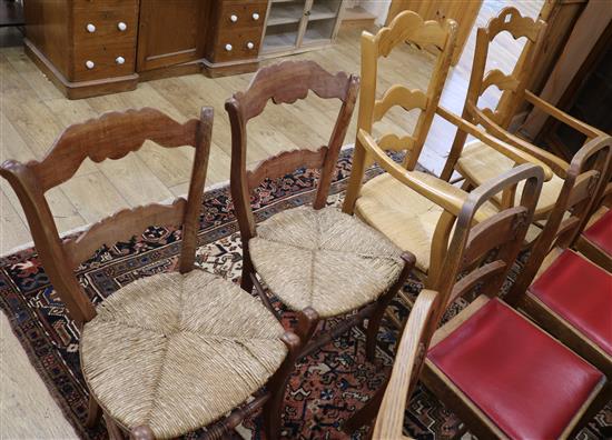A pair of French beech rush seated elbow chairs and two single chairs